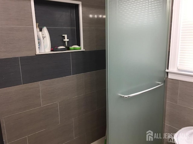 bathroom with a shower stall