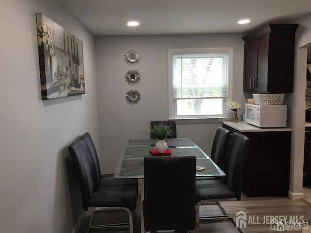 dining space featuring recessed lighting