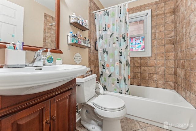 full bath featuring shower / bath combo with shower curtain, toilet, vanity, and tile patterned flooring