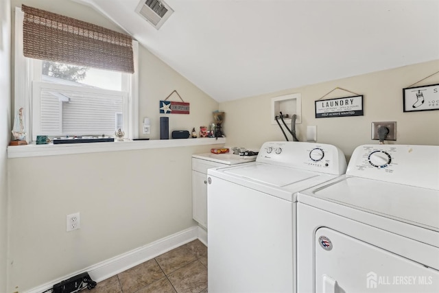 laundry room with tile patterned floors, visible vents, cabinet space, baseboards, and washing machine and clothes dryer