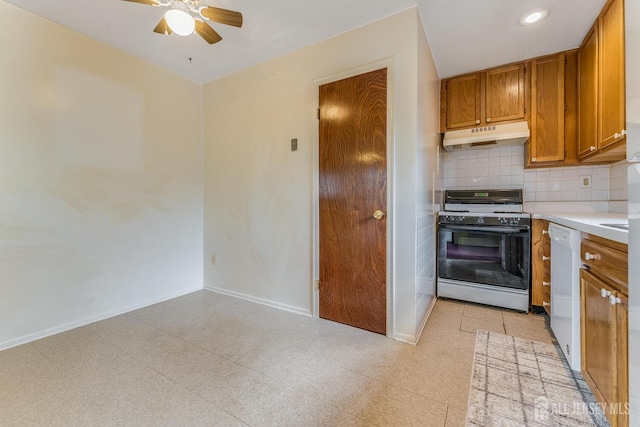 4420 Birchwood Ct, North Brunswick, NJ 08902 - kitchen with gas range oven, under cabinet range hood, a ceiling fan, brown cabinets, and light countertops