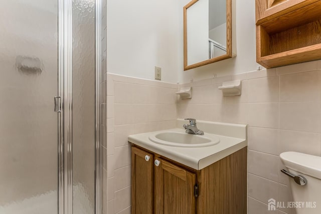 4420 Birchwood Ct, North Brunswick, NJ 08902 - bathroom featuring tile walls, a shower stall, and vanity