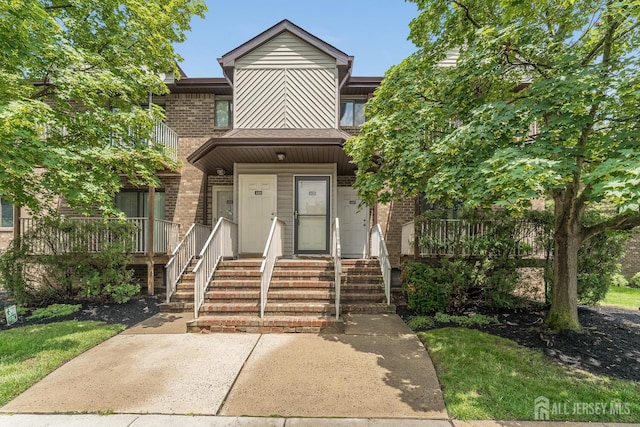 4420 Birchwood Ct, North Brunswick, NJ 08902 - view of property with brick siding and a porch