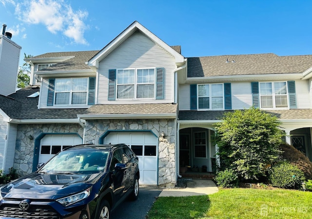91 Heather Ct, South Brunswick, NJ 08852 - view of front of home with stone siding, a garage, driveway, and a shingled roof
