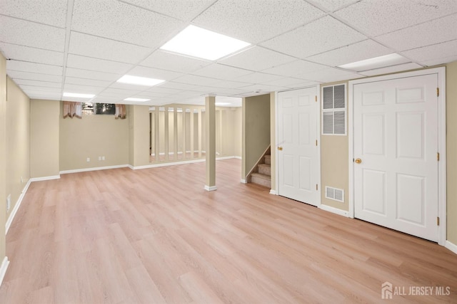 204 Concord Pl, North Brunswick, NJ 08902 - finished below grade area featuring light wood-style flooring, stairs, and a paneled ceiling