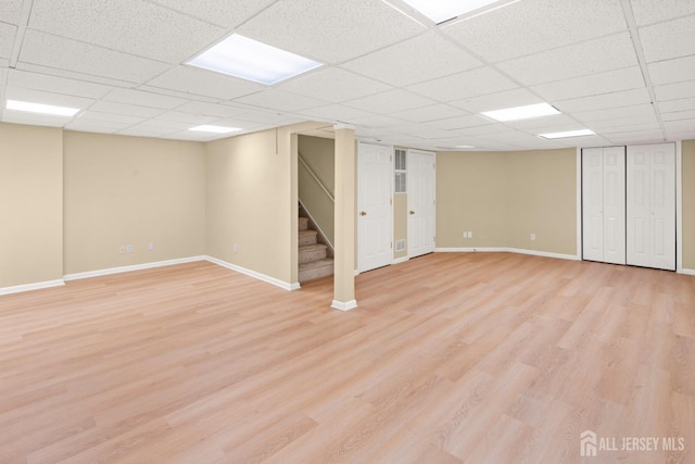 204 Concord Pl, North Brunswick, NJ 08902 - finished below grade area featuring stairway, light wood-style floors, and a paneled ceiling