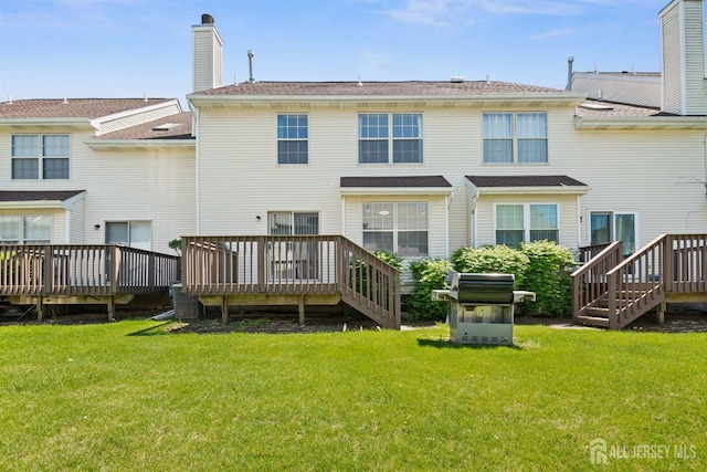 204 Concord Pl, North Brunswick, NJ 08902 - rear view of house featuring a wooden deck and a yard