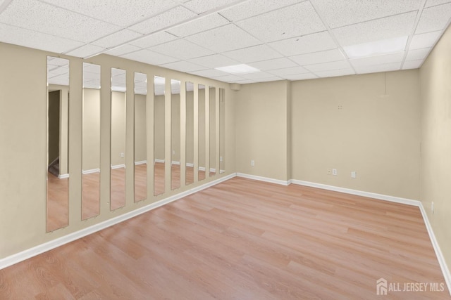 204 Concord Pl, North Brunswick, NJ 08902 - below grade area featuring a drop ceiling and light wood-type flooring