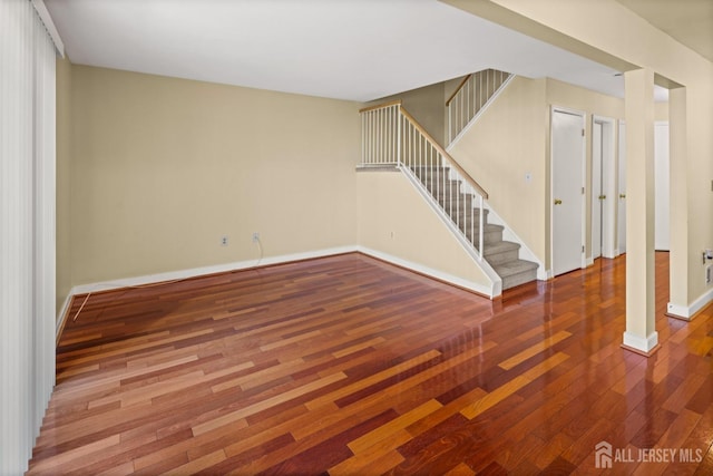 204 Concord Pl, North Brunswick, NJ 08902 - unfurnished living room with stairs and wood finished floors