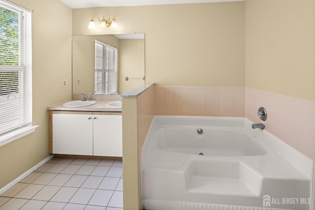 204 Concord Pl, North Brunswick, NJ 08902 - bathroom featuring double vanity, a jetted tub, and tile patterned floors