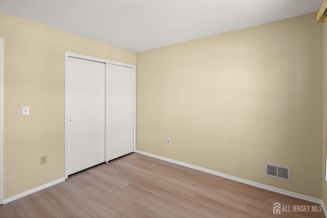 204 Concord Pl, North Brunswick, NJ 08902 - unfurnished bedroom with wood finished floors and a closet