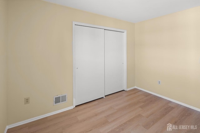 204 Concord Pl, North Brunswick, NJ 08902 - unfurnished bedroom featuring light wood-style flooring and a closet