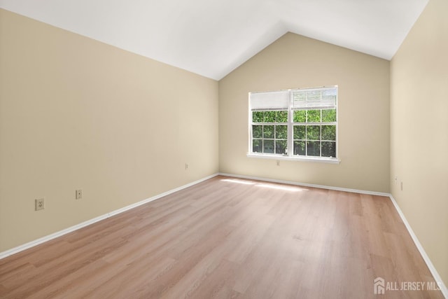 204 Concord Pl, North Brunswick, NJ 08902 - spare room featuring light wood finished floors and vaulted ceiling
