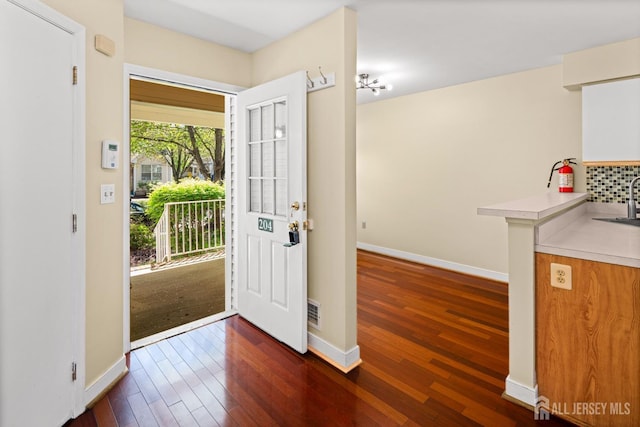 204 Concord Pl, North Brunswick, NJ 08902 - foyer featuring dark wood finished floors