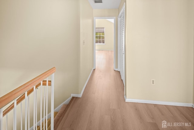 204 Concord Pl, North Brunswick, NJ 08902 - hall with light wood-type flooring and an upstairs landing