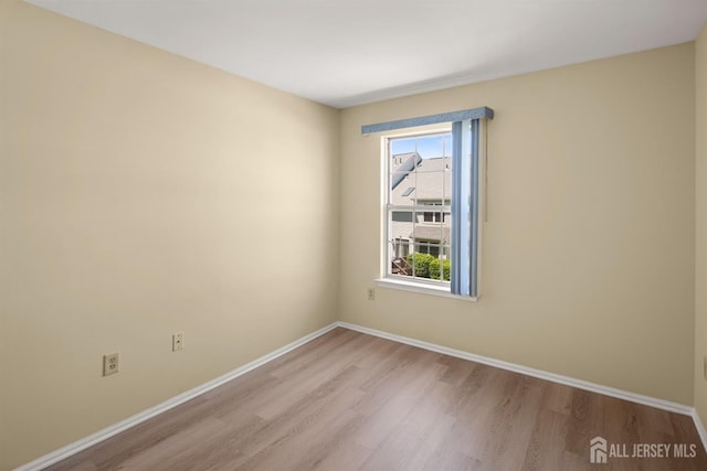 204 Concord Pl, North Brunswick, NJ 08902 - empty room with wood finished floors and baseboards