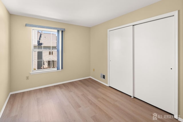 204 Concord Pl, North Brunswick, NJ 08902 - unfurnished bedroom featuring wood finished floors and a closet