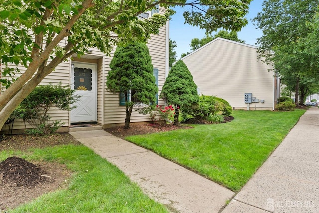 372 Mcdowell Dr, East Brunswick, NJ 08816 - doorway to property with a yard