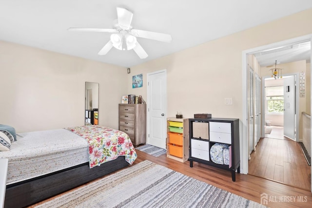 372 Mcdowell Dr, East Brunswick, NJ 08816 - bedroom featuring wood finished floors, ceiling fan, and ensuite bath