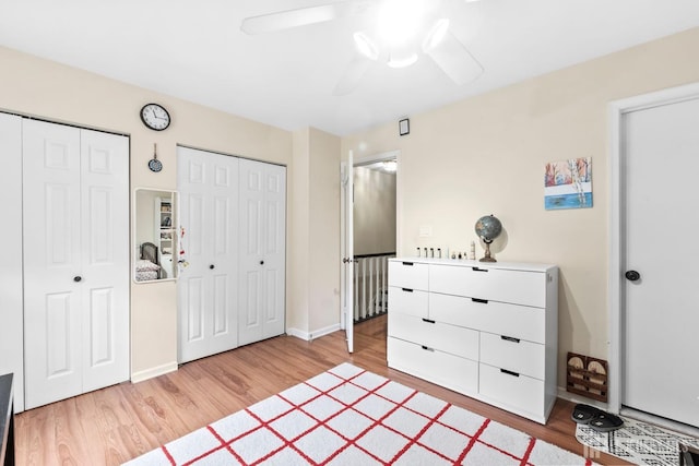 372 Mcdowell Dr, East Brunswick, NJ 08816 - bedroom featuring two closets, light wood-type flooring, and ceiling fan