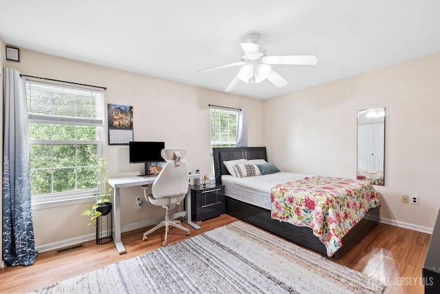 372 Mcdowell Dr, East Brunswick, NJ 08816 - bedroom with wood finished floors, ceiling fan, and a desk