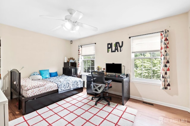 372 Mcdowell Dr, East Brunswick, NJ 08816 - bedroom with wood finished floors, a desk, and ceiling fan