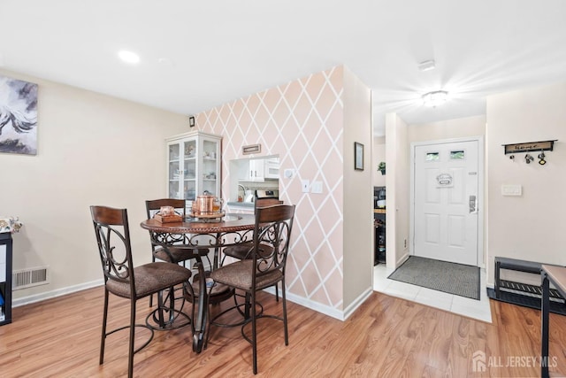 372 Mcdowell Dr, East Brunswick, NJ 08816 - dining room with light wood finished floors