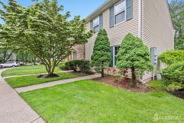 372 Mcdowell Dr, East Brunswick, NJ 08816 - view of home's exterior with a yard