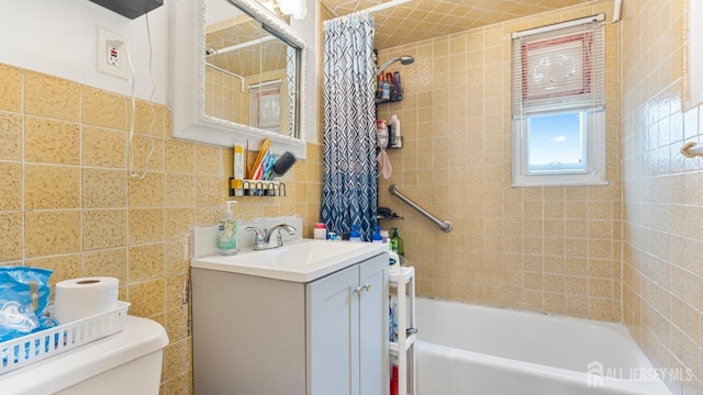 149 Ethel St, Menlo Park Terrace, NJ 08840 - bathroom featuring toilet, vanity, shower / bath combination with curtain, and tile walls