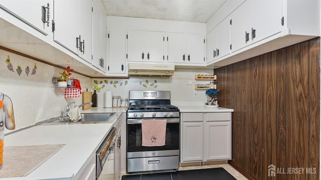 149 Ethel St, Menlo Park Terrace, NJ 08840 - kitchen featuring stainless steel range with gas stovetop, under cabinet range hood, dishwashing machine, light countertops, and white cabinetry