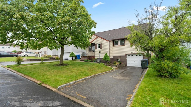 149 Ethel St, Menlo Park Terrace, NJ 08840 - view of front of house with a front yard, asphalt driveway, and an attached garage