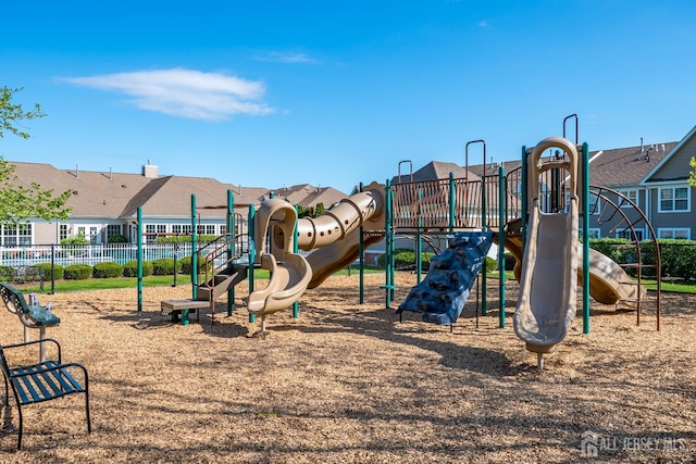 community jungle gym with fence