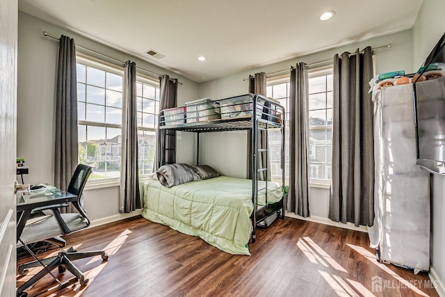 bedroom with recessed lighting, baseboards, visible vents, and dark wood-type flooring