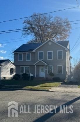 view of front of house with a front lawn