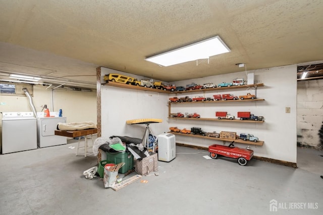 storage room with washing machine and clothes dryer