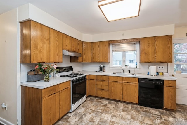 kitchen with gas stove, dishwasher, under cabinet range hood, light countertops, and brown cabinets