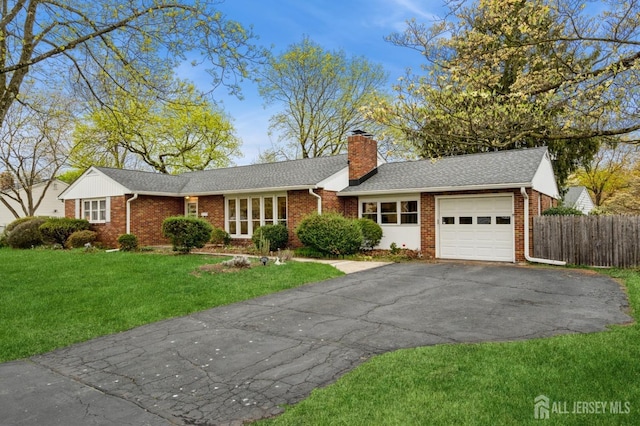 ranch-style house featuring an attached garage, brick siding, asphalt driveway, a chimney, and roof with shingles