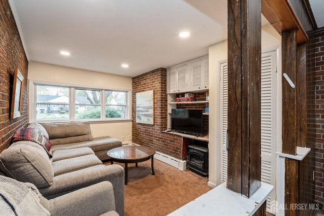 carpeted living area featuring brick wall, a baseboard radiator, and recessed lighting