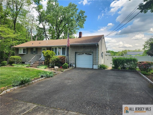 single story home with a garage, a chimney, asphalt driveway, and roof with shingles