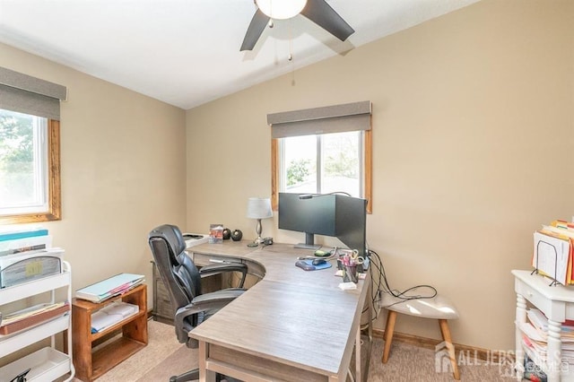 office with a ceiling fan, carpet floors, and lofted ceiling