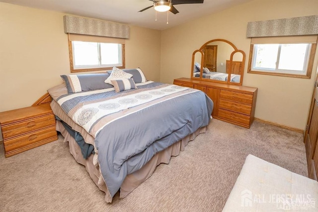 bedroom featuring multiple windows, carpet floors, and ceiling fan
