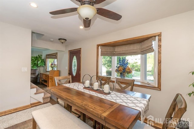 dining space with baseboards, a ceiling fan, and recessed lighting