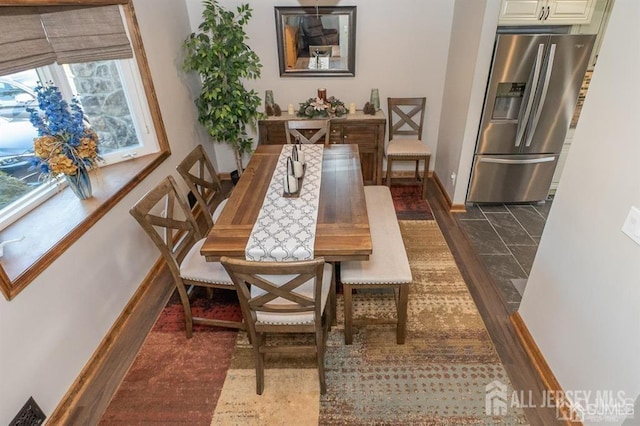 dining room with baseboards