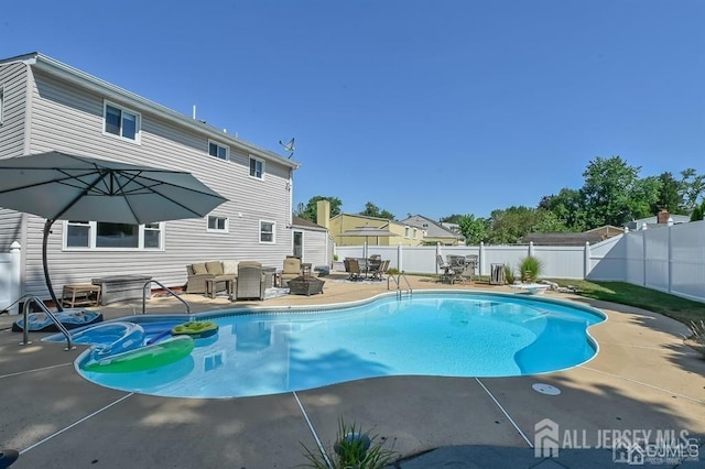 view of swimming pool featuring an outdoor living space, a fenced backyard, a patio, and a diving board