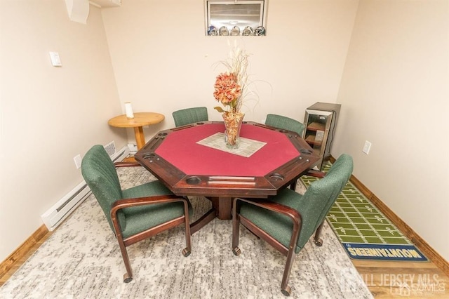 dining space featuring baseboard heating and baseboards