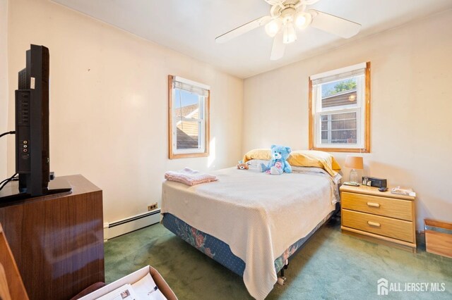 carpeted bedroom featuring ceiling fan and a baseboard radiator