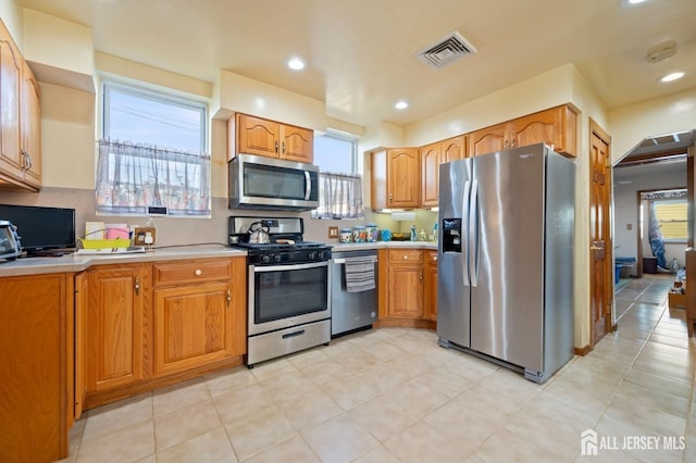 kitchen with backsplash and stainless steel appliances