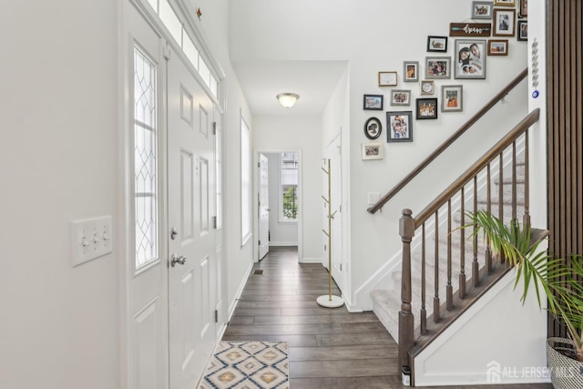 106 Ellsworth Way S, Brunswick, NJ 08852 - foyer entrance with stairway, dark wood-type flooring, and baseboards