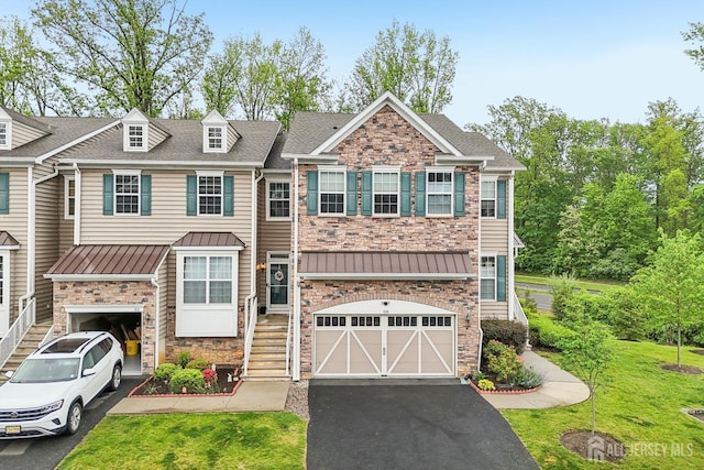 106 Ellsworth Way S, Brunswick, NJ 08852 - multi unit property with stone siding, an attached garage, asphalt driveway, and a standing seam roof