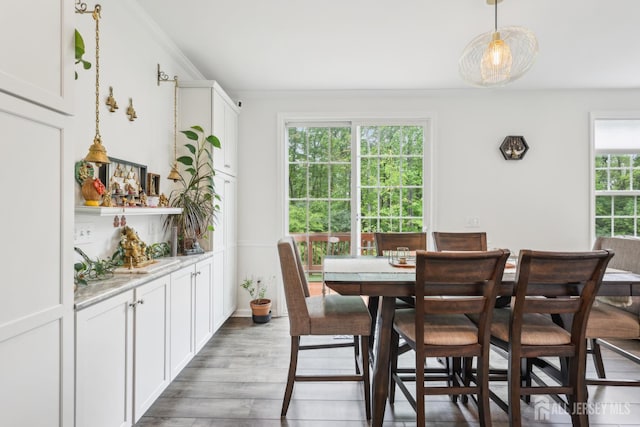 106 Ellsworth Way S, Brunswick, NJ 08852 - dining room featuring light wood-type flooring and crown molding